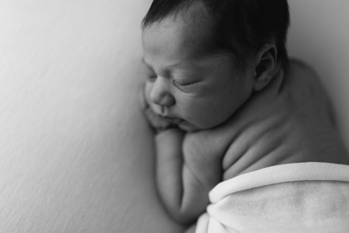 2 week old baby black and white image