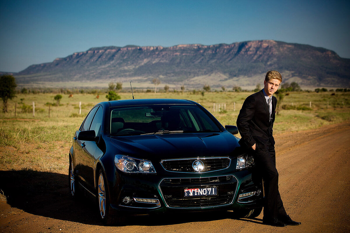 senior boy by car in Blackwater, QLD