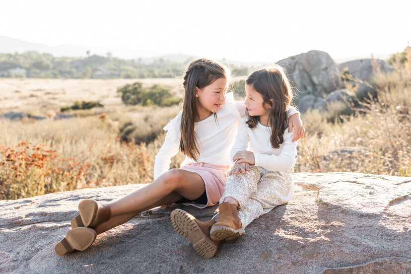 san-diego-family-portrait-sisters-sitting-on-rock-wrights-field