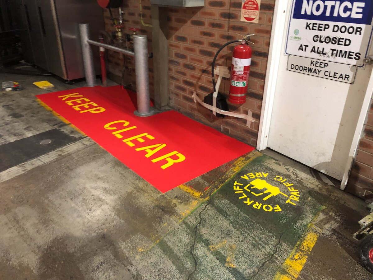 Line marking of a keep clear area, within an industrial commercial  floor space. Also a forklift traffic area line marking.