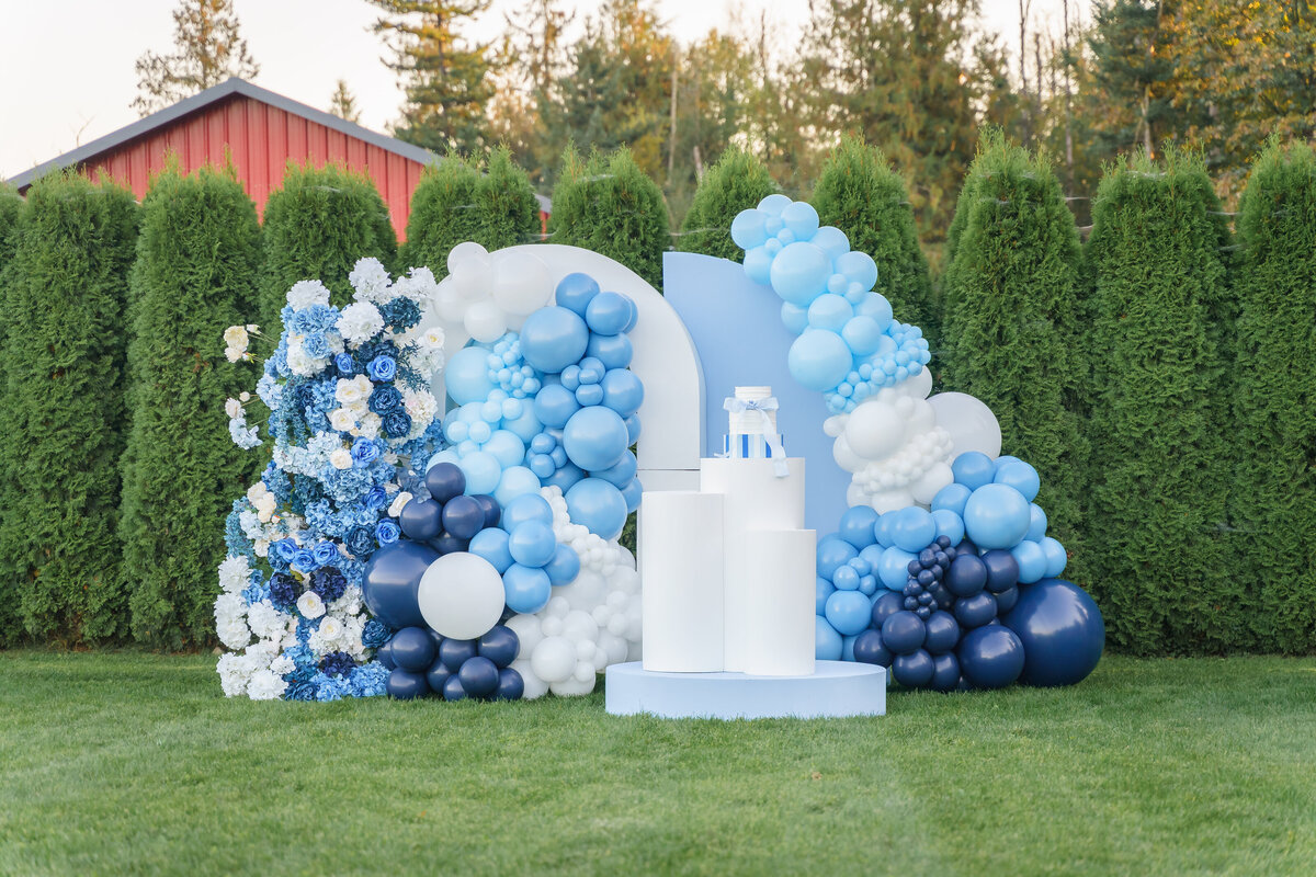 Blue balloon arch installation for party in Lynden