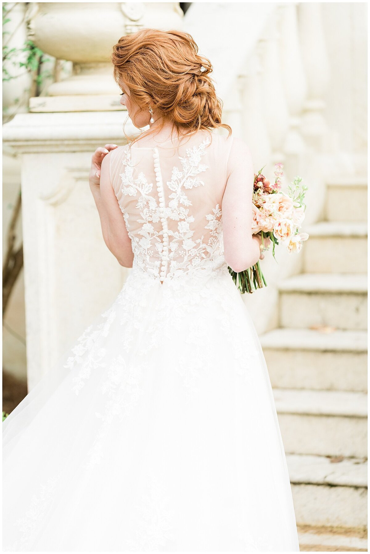 Bride with red hair in dress with lace back