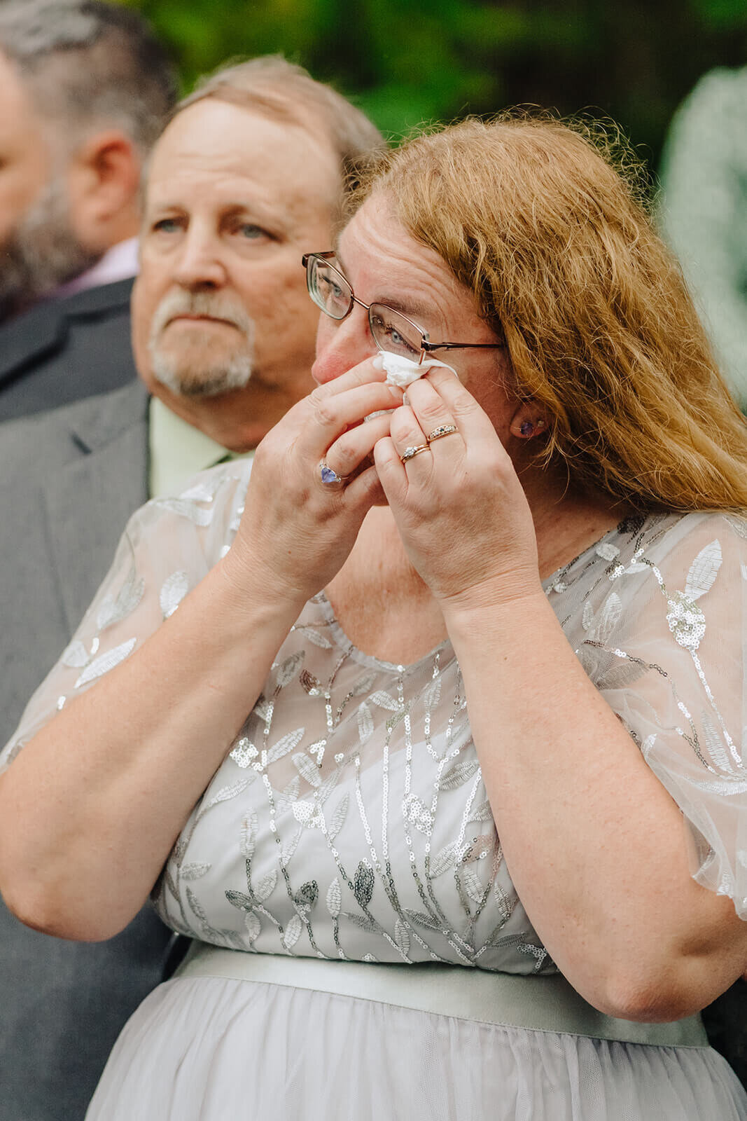 wedding guest dabbing ey with a tissue