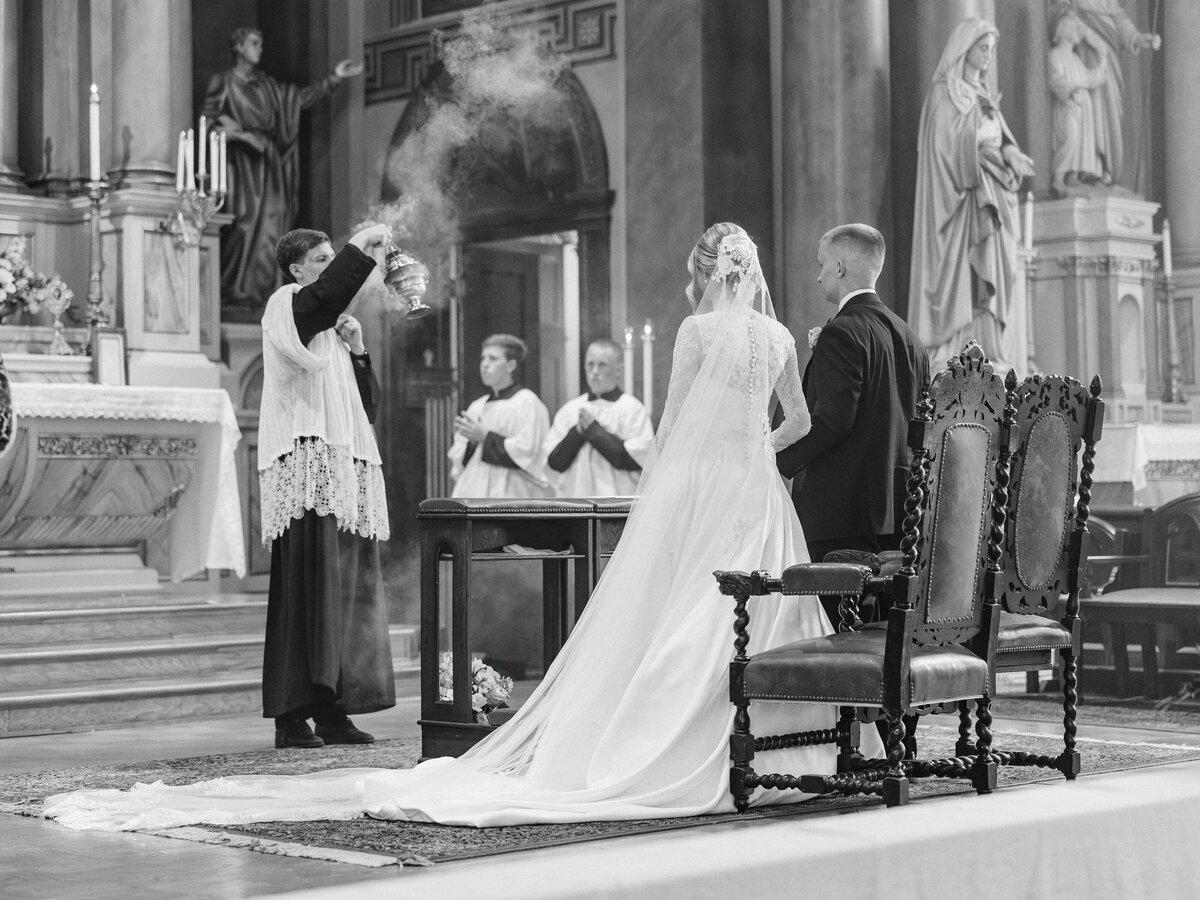 Priest swinging Thurible during traditional Latin Mass at Old St Marys wedding-in Cincinnati