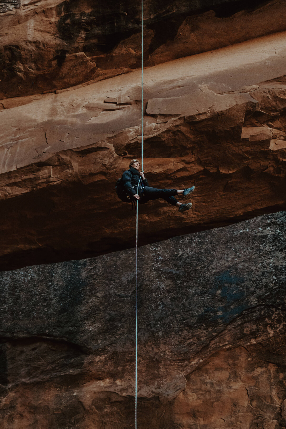 Cinematic rock climbing photography, highlighting movement and determination.