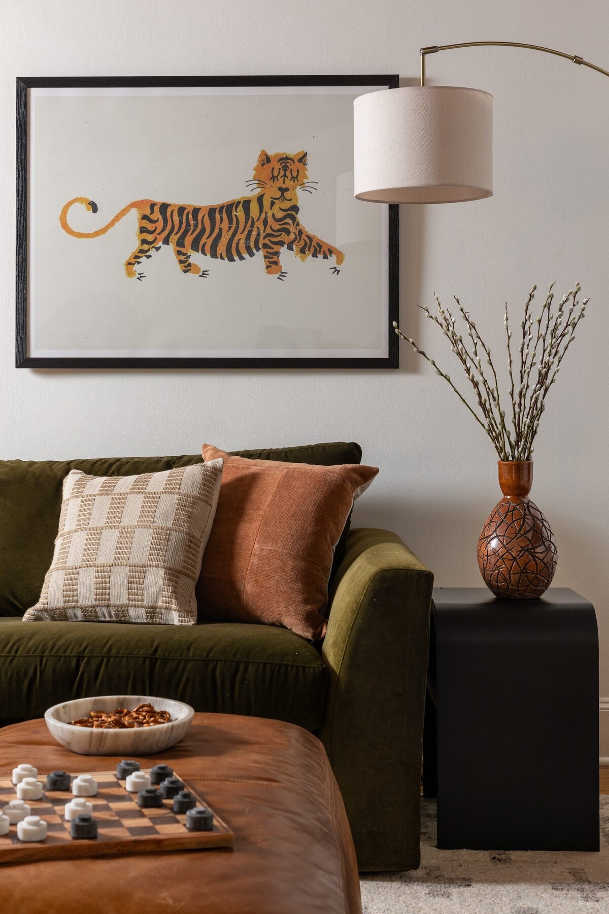 melinda chesson interiors murrayhill road living room with tiger art piece on wall and olive color sofa
