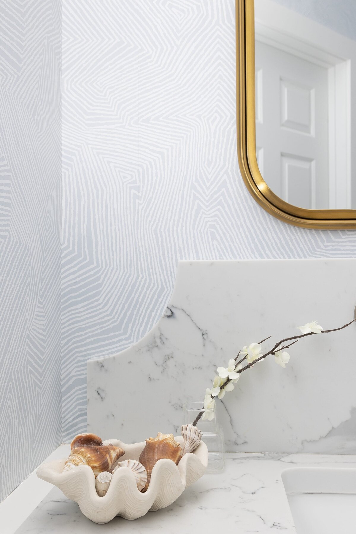 dewine design orlando interior designer contemporary coastal powder bathroom bowl of shells on counter
