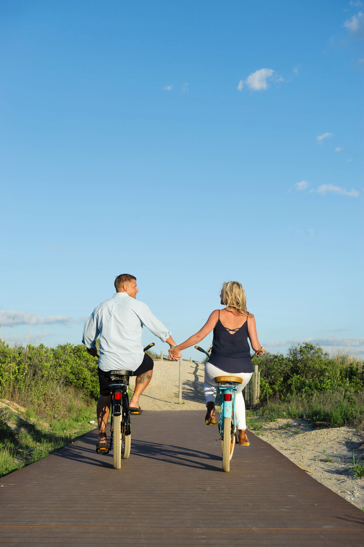 holding_hands_on_bikes_engagement_photo
