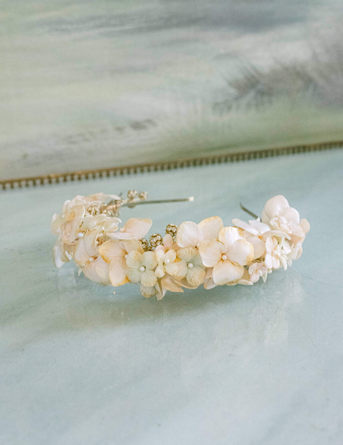 A wedding day photo of the brides floral head piece at Hedsor House in the UK