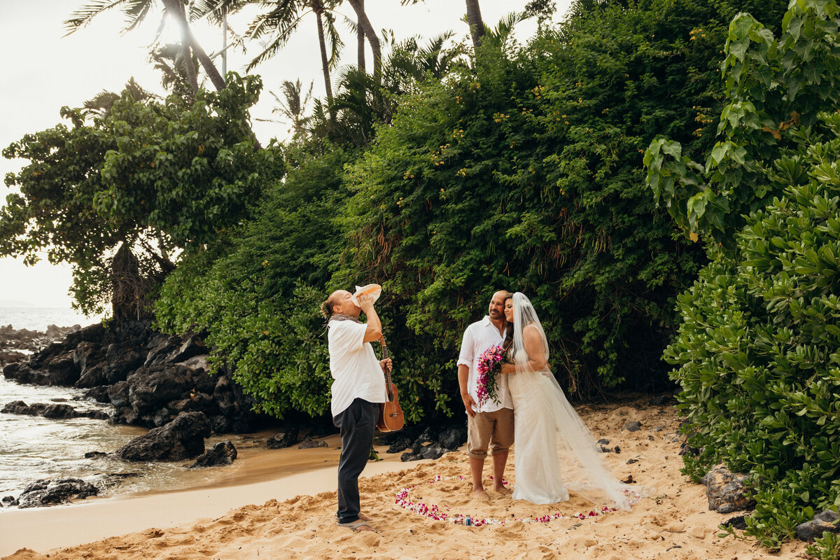 Maui Wedding Photographer captures bride and groom oceanside during intimate wedding ceremony