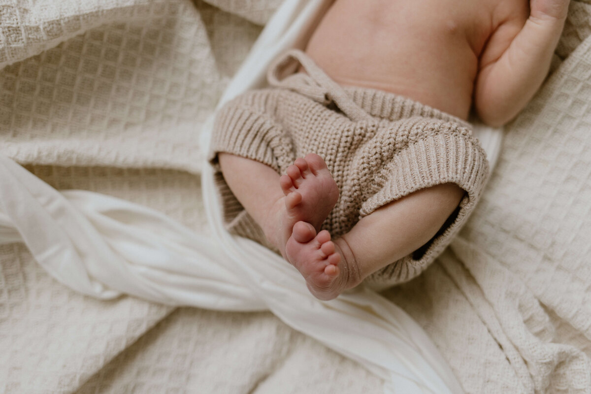 Photo of a baby yawning and stretching