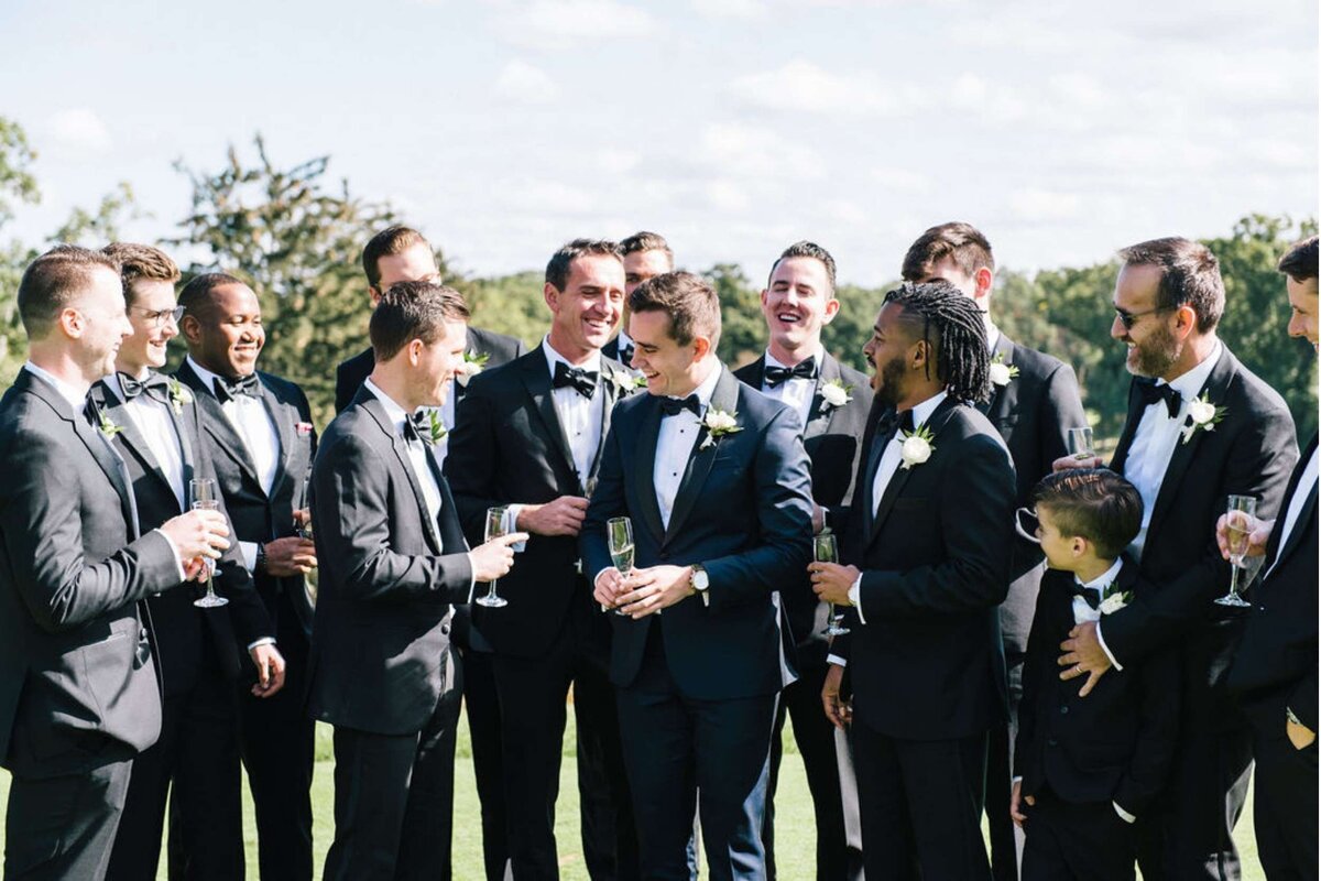 Groomsmen Portraits on the Golf Course at a Luxury Michigan Lakefront Golf Club Wedding.