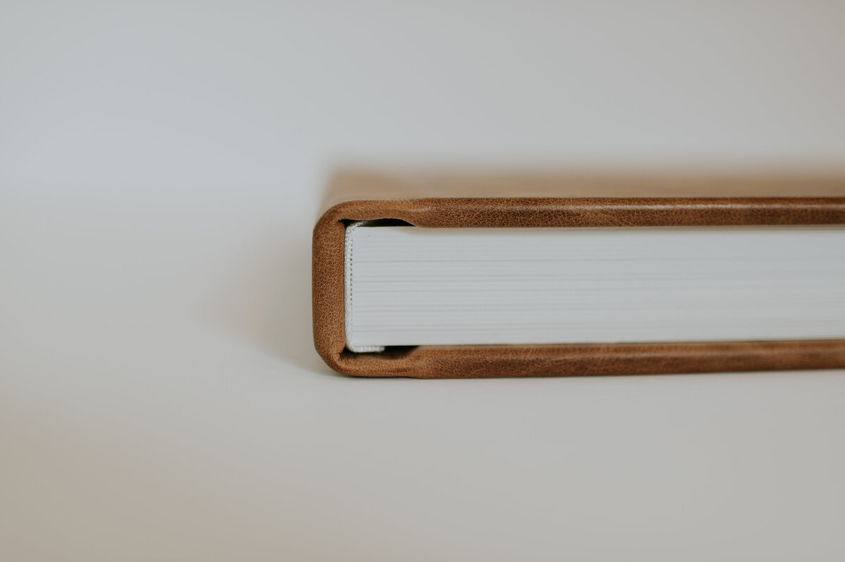Side view of closed wedding album spine