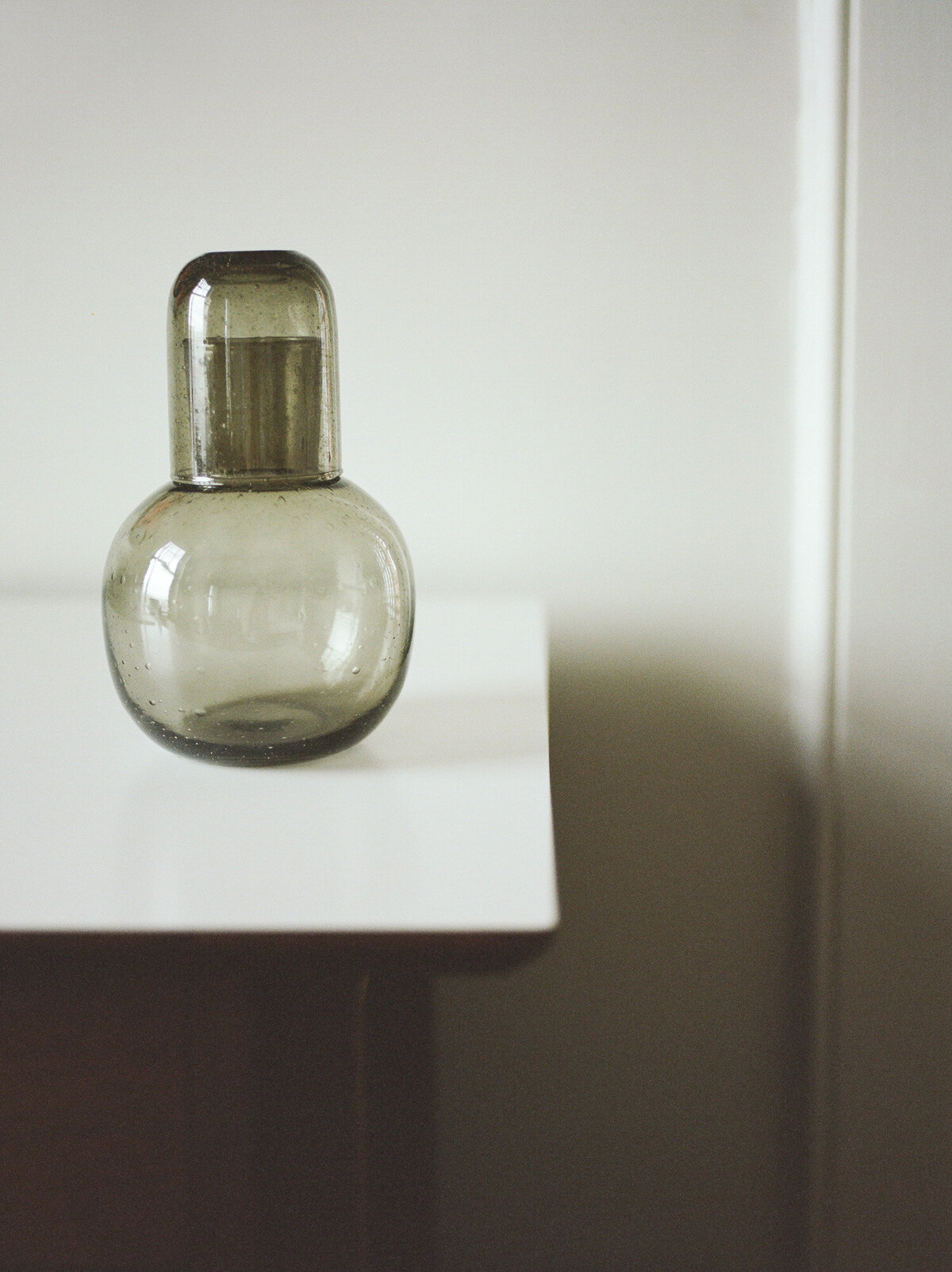 clear green hand blown glass carafe, details at ALEO Detroit, film brand photo