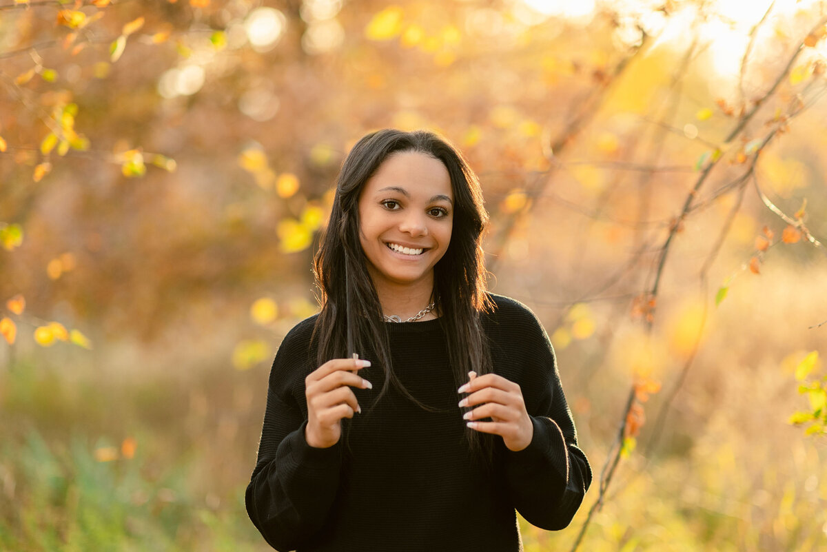 High school senior girl in the fall woods by Oak Park IL senior photographer Kristen Hazelton
