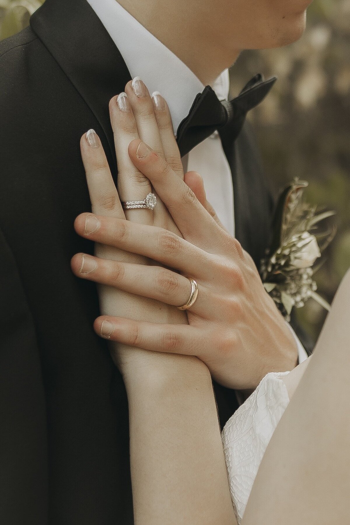 bride and grooms hands and rings