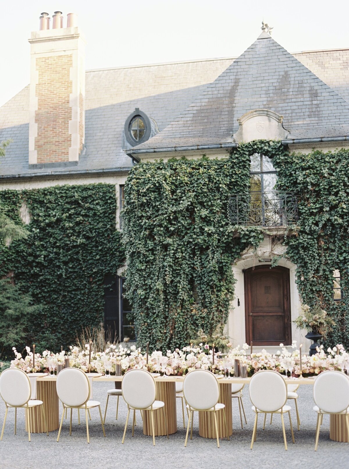wedding reception table setup outside mansion