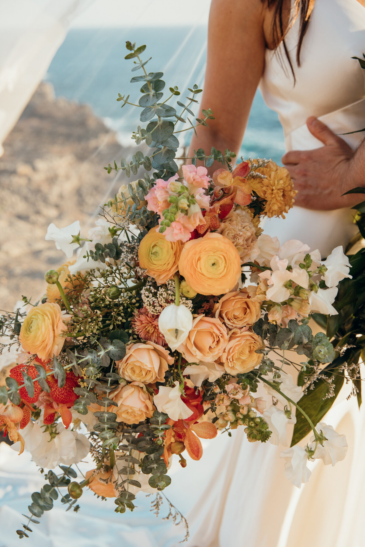 Maui Wedding Photographer captures bride holding bouquet