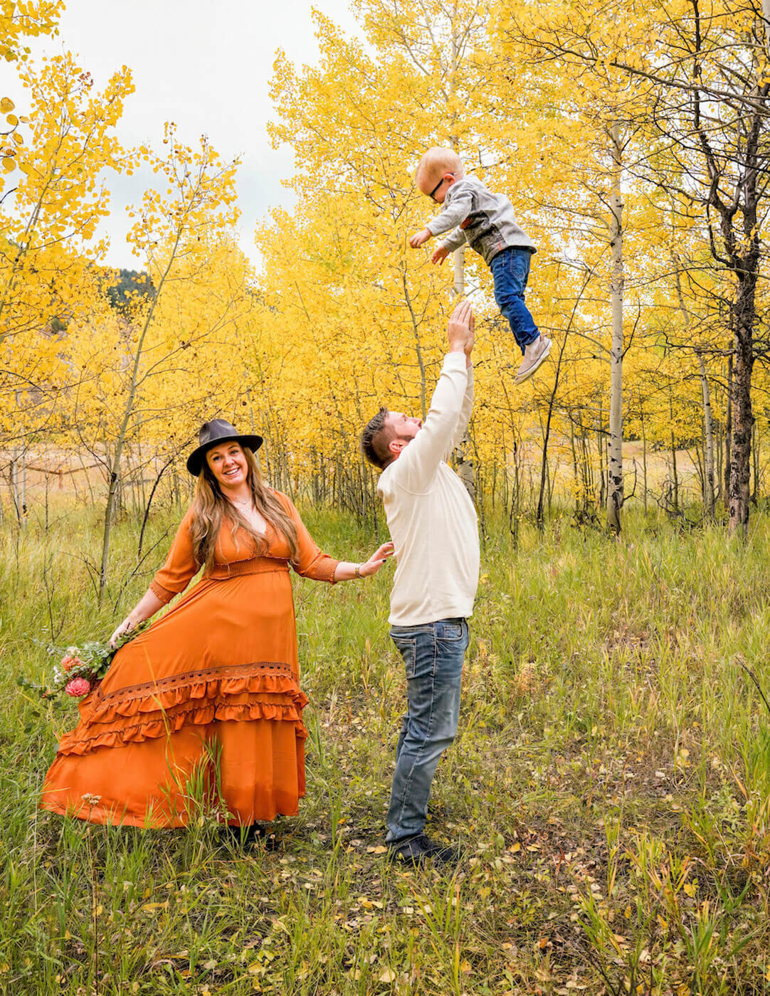 denver family photography - man throwing child in air