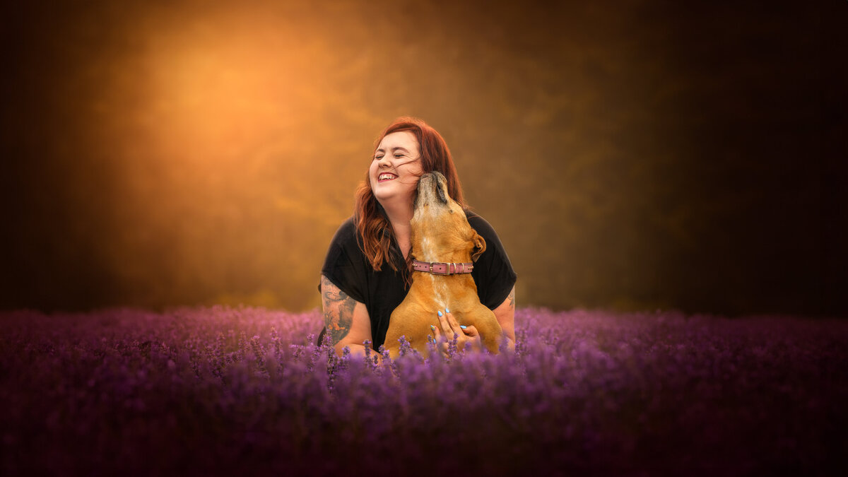 dogo giving owner kiss in middle of lavender farm