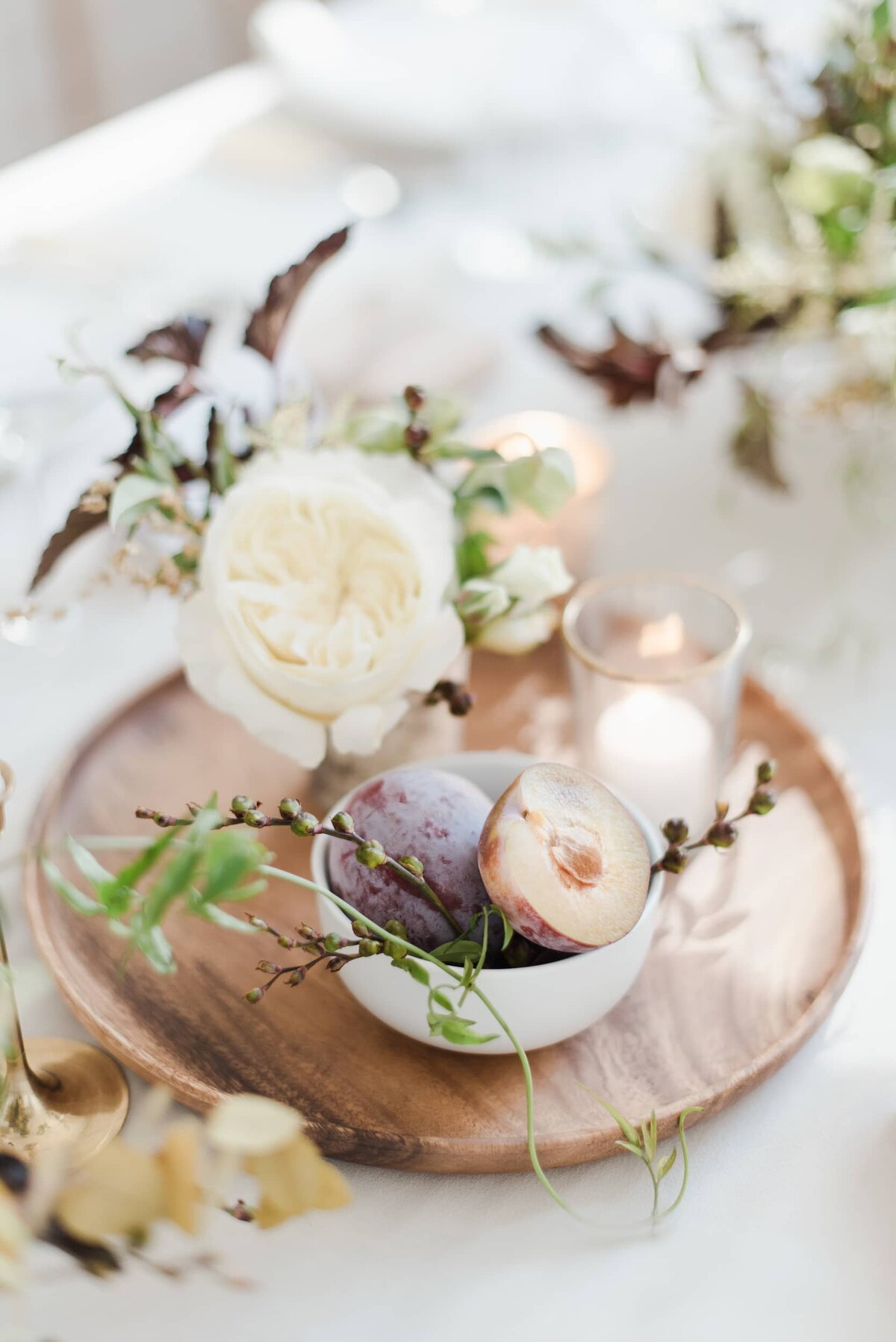 Green and white centerpiece on wood