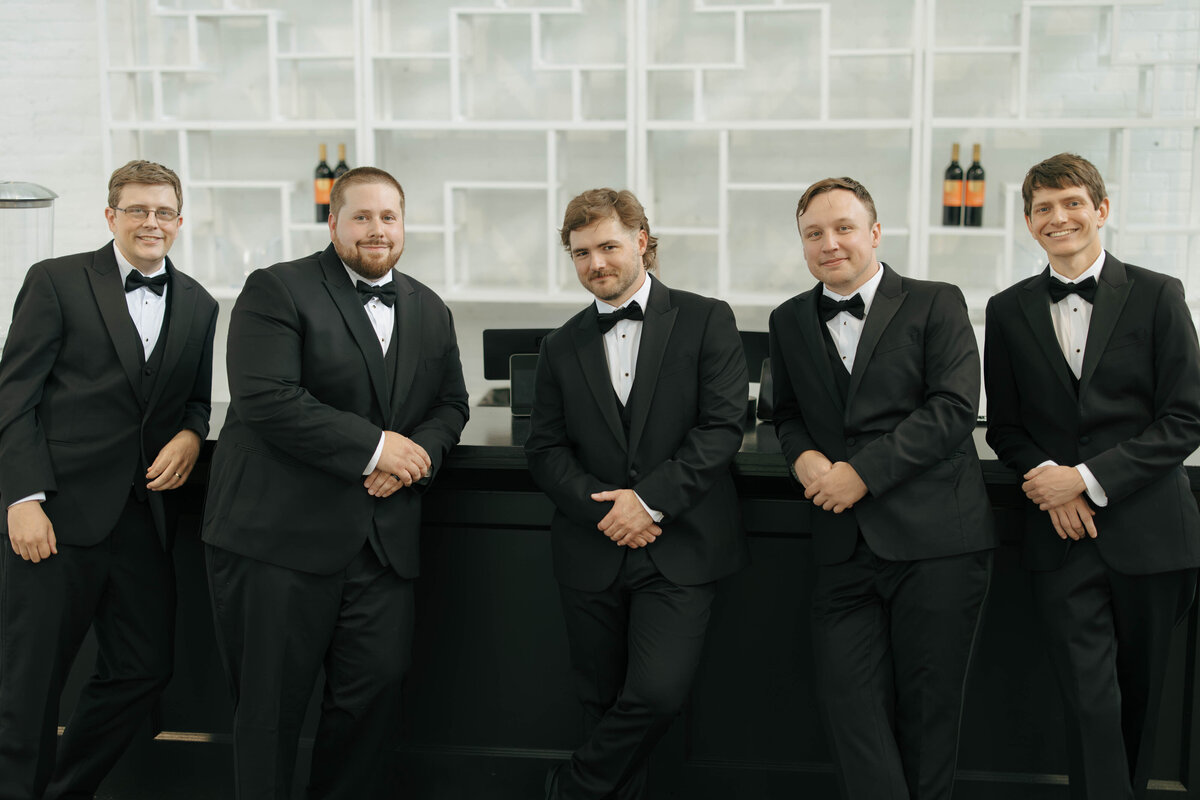 Groom and groomsmen poses inside the Madison venue in Cleveland, Ohio