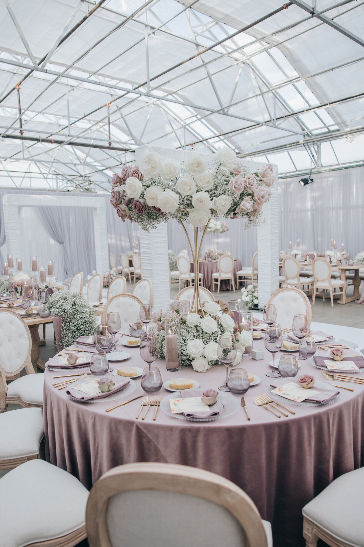 Gorgeous lavender and ivory themed wedding reception photographed by Nova Markina