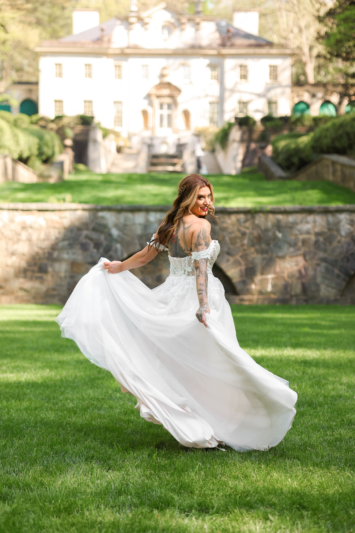 Bride twirling in her off the shoulder lace dress at The Swan House in Atlanta Georgia by Atlanta Georgia wedding photographer Amanda Richardson Photography