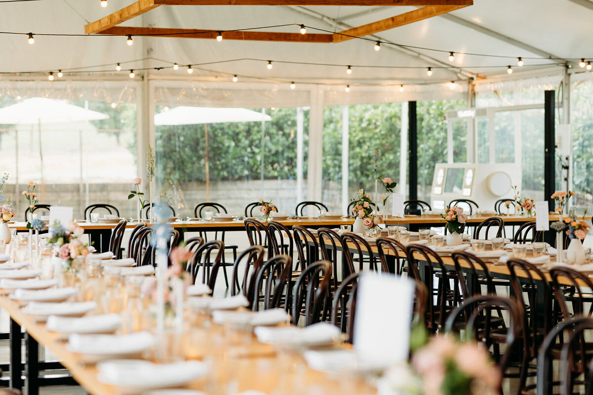 Inside the reception marquee at Poachers Pantry. Photo by Acacia & Grace Photography, a Canberra Wedding Photographer.