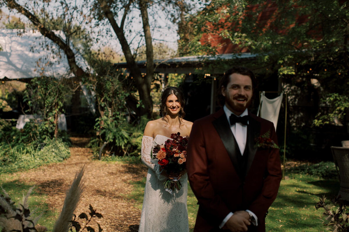 first look photo right before the groom turns to see his beautiful bride to be 