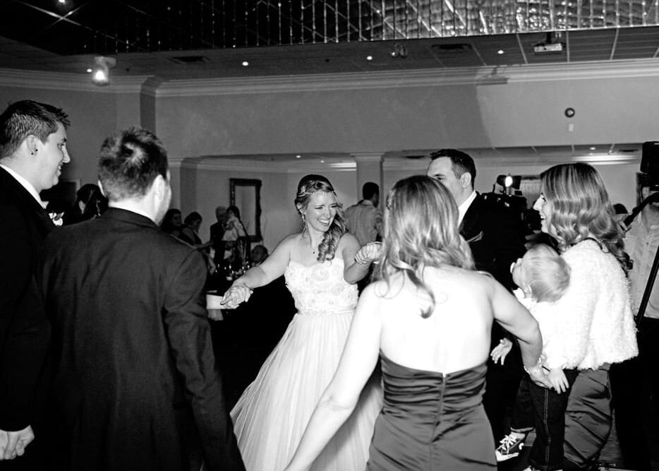 Bride and Groom Holding Hands at Wedding