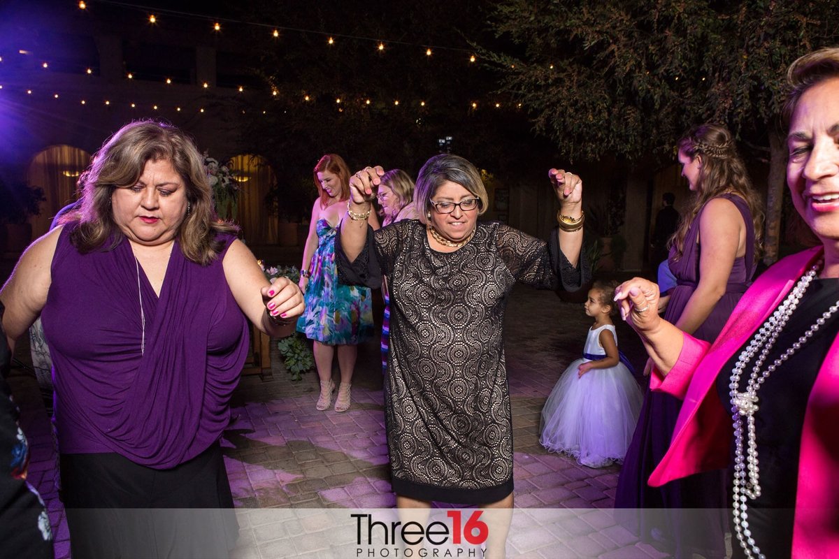 Guests dance at the wedding reception