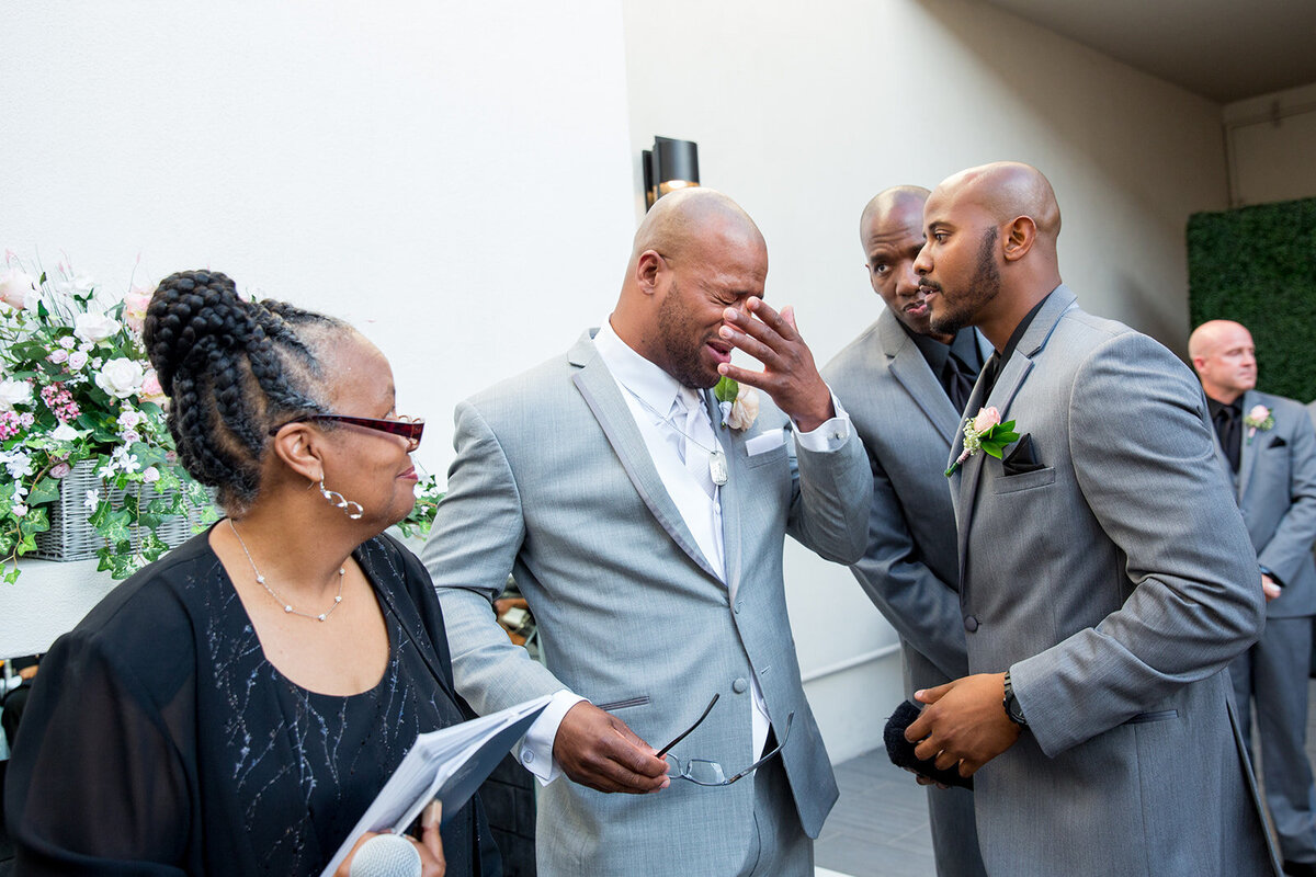 SoHo63 wedding of a groom crying when he sees his bride for the first time. Wedding photos by DePoy Studios.