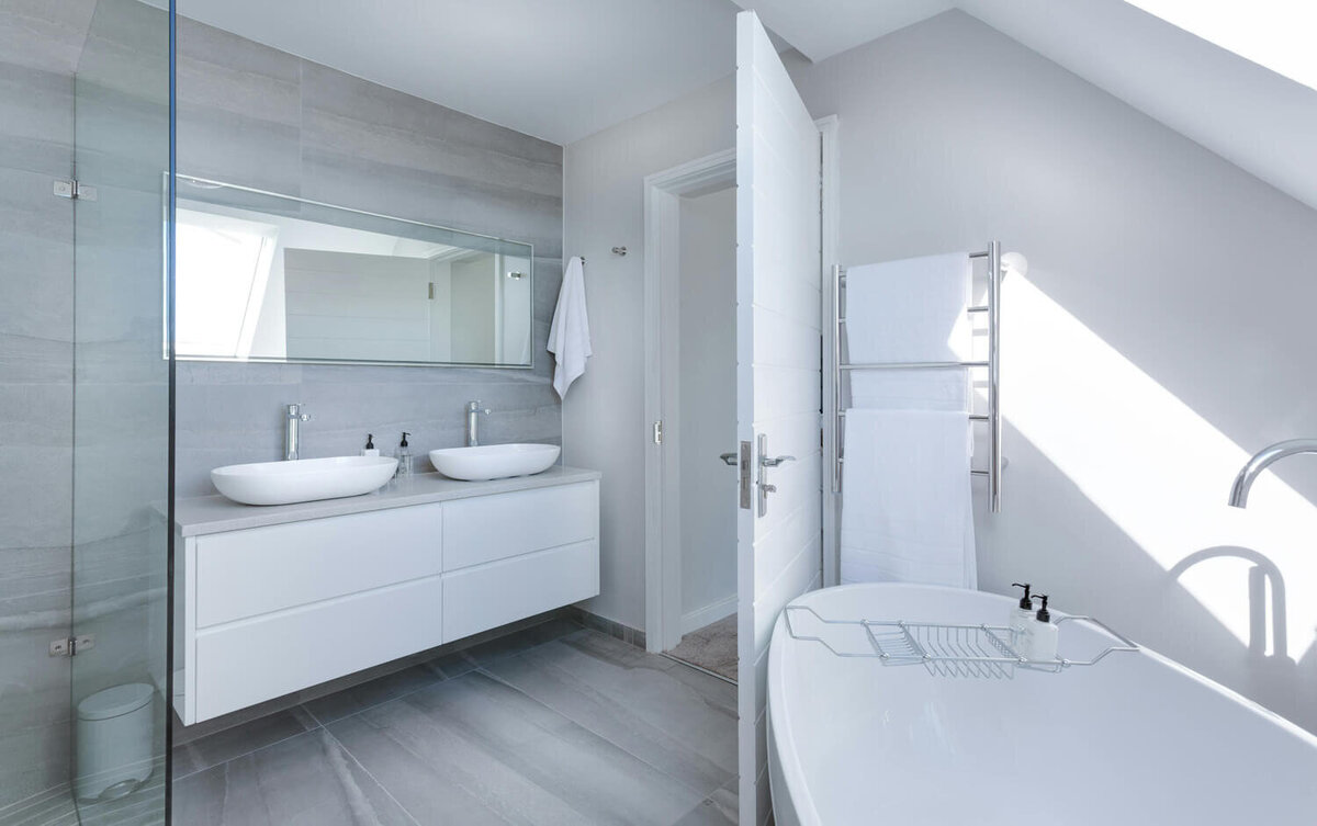 Photo of a white, freshly cleaned bathroom