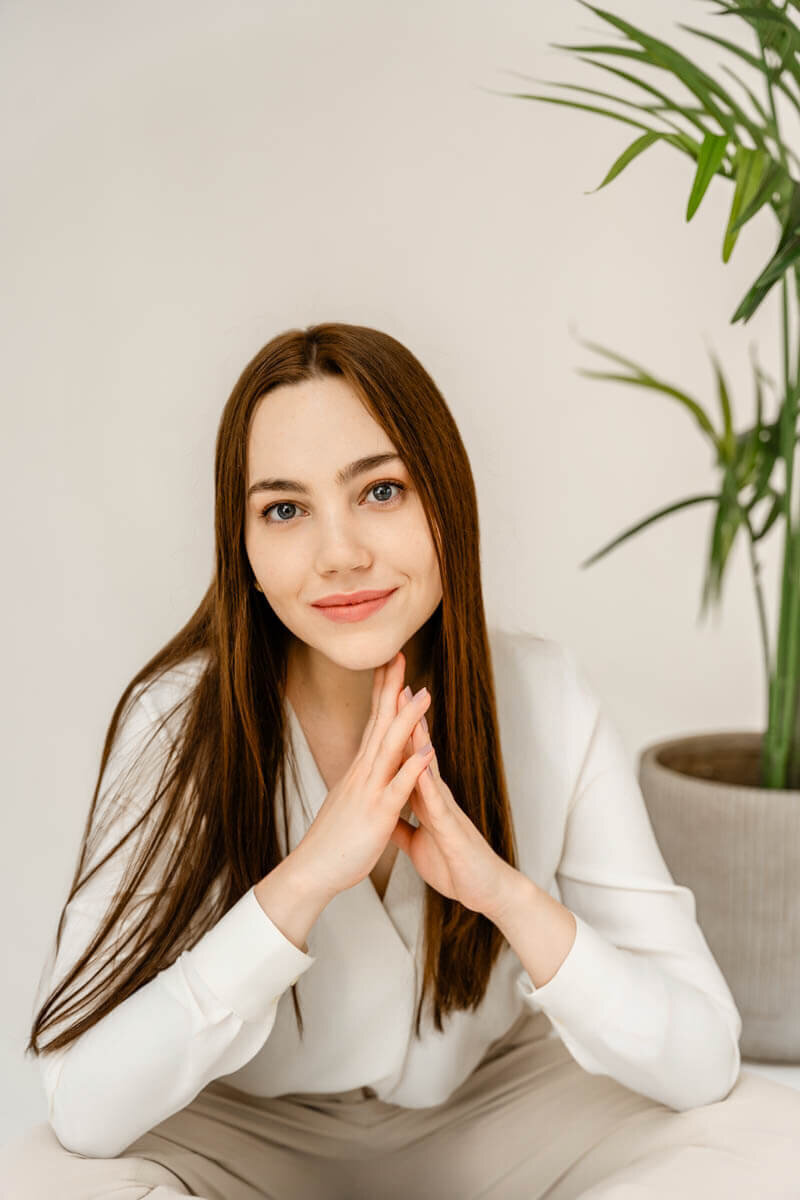 portrait of a social media consultant sitting on a floor posing for maryland brand photographer