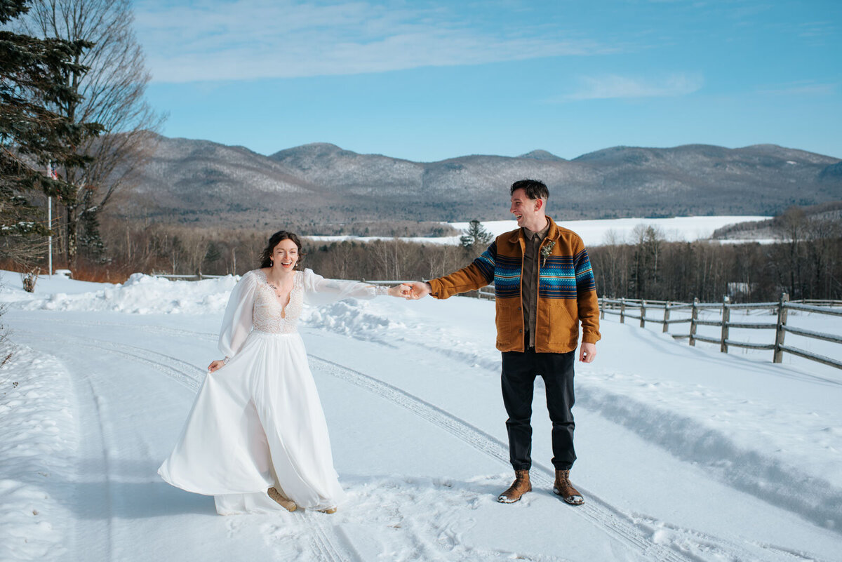 winter elopement couple dancing with mountain view at mountain top inn chittenden vermont