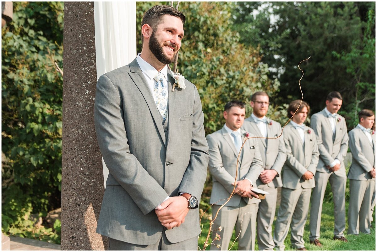 Groom getting ready for bride to walk down the aisle at Oak Hills Reception and Event Center