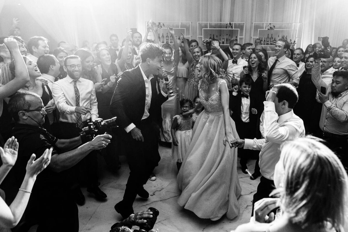 A bride dances with the lead singer of the Arkells on her wedding day.