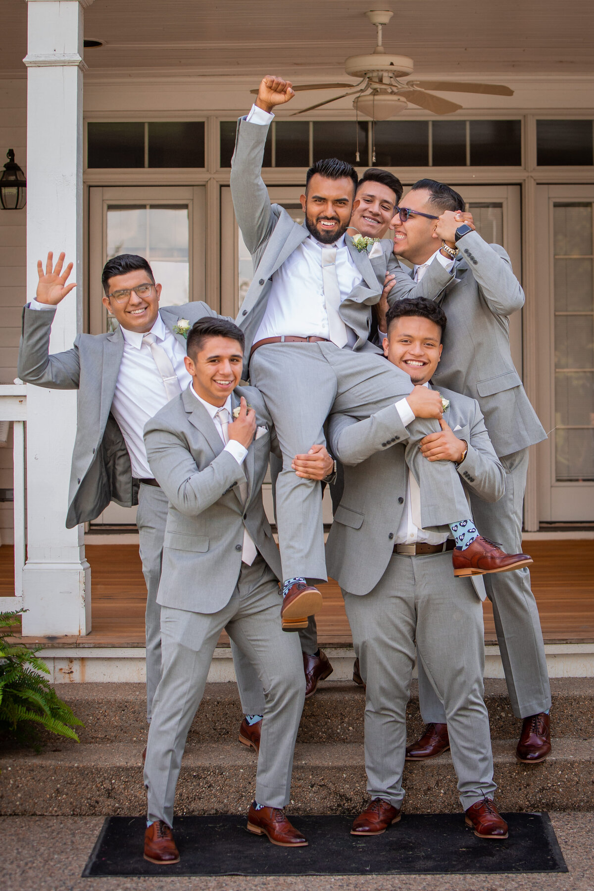 Fun Groomsmen Photo At Wedding Hawthorne House in Parkville Missouri