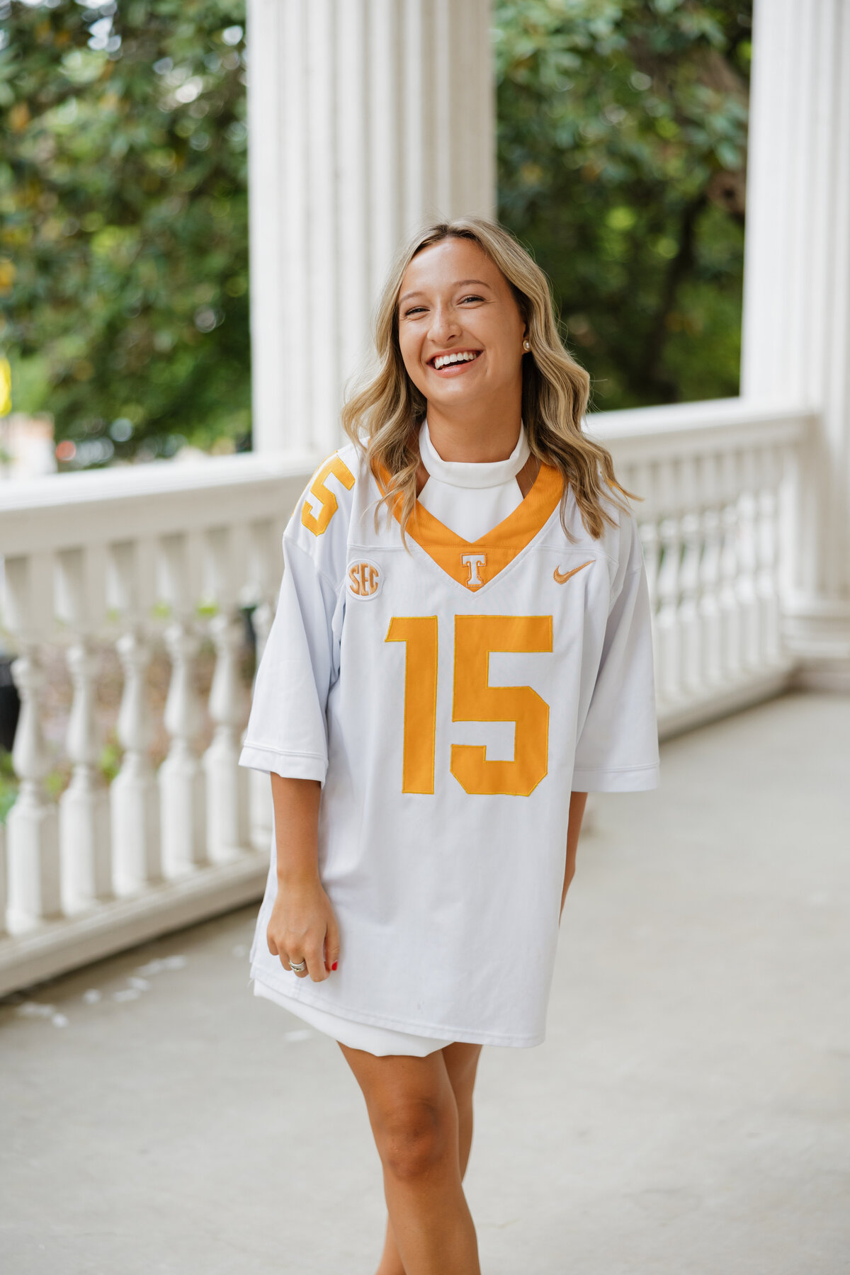 Cambell lets out a little bit of laughter as she wears her oversized Tennessee jersey.