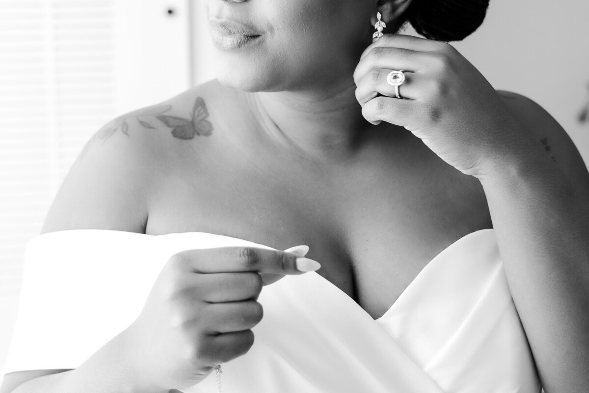 black bride putting in earrings photographed by black photographers