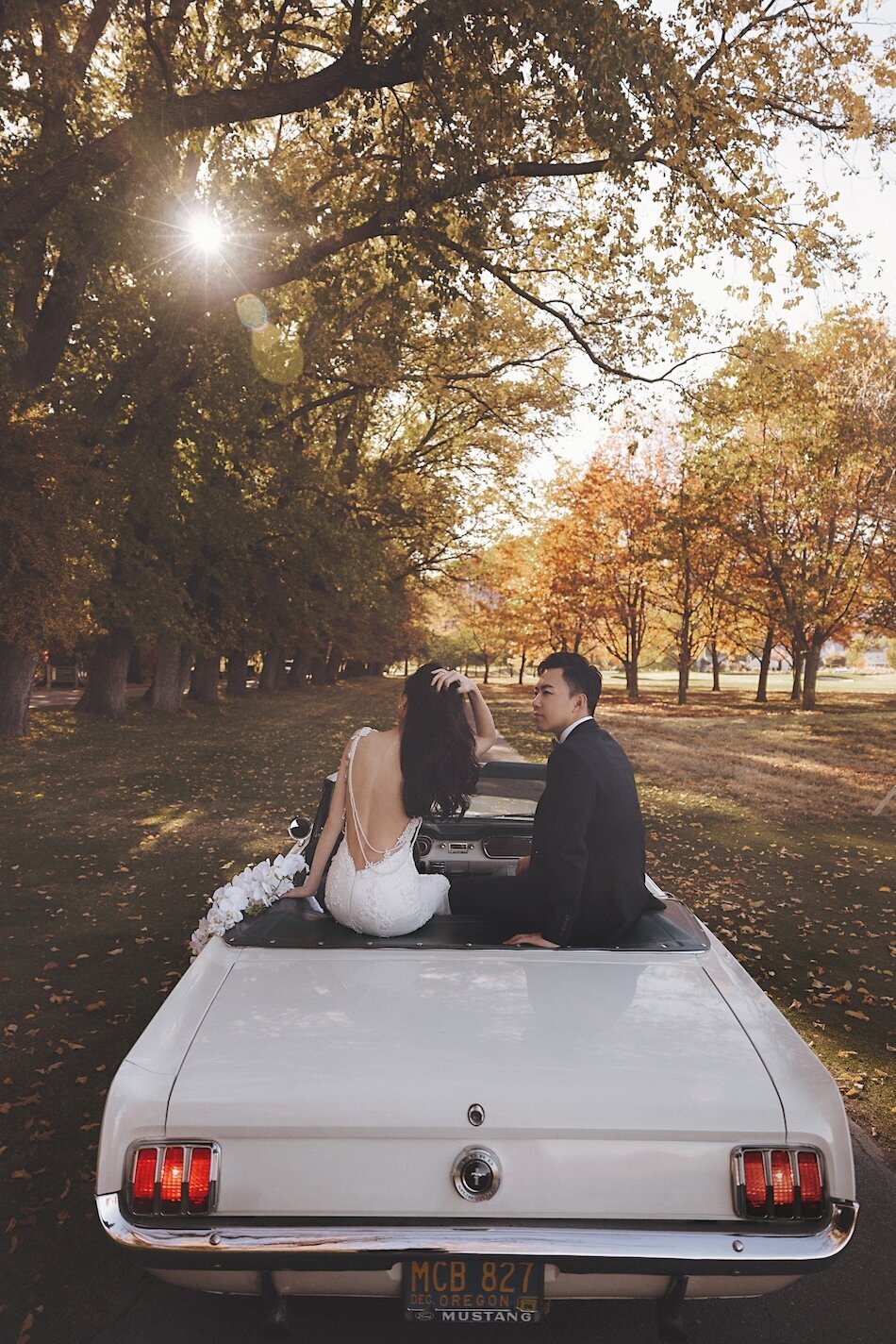 Autumn wedding shoot at Millbrook, Arrowtown. Vintage car & helicopter.