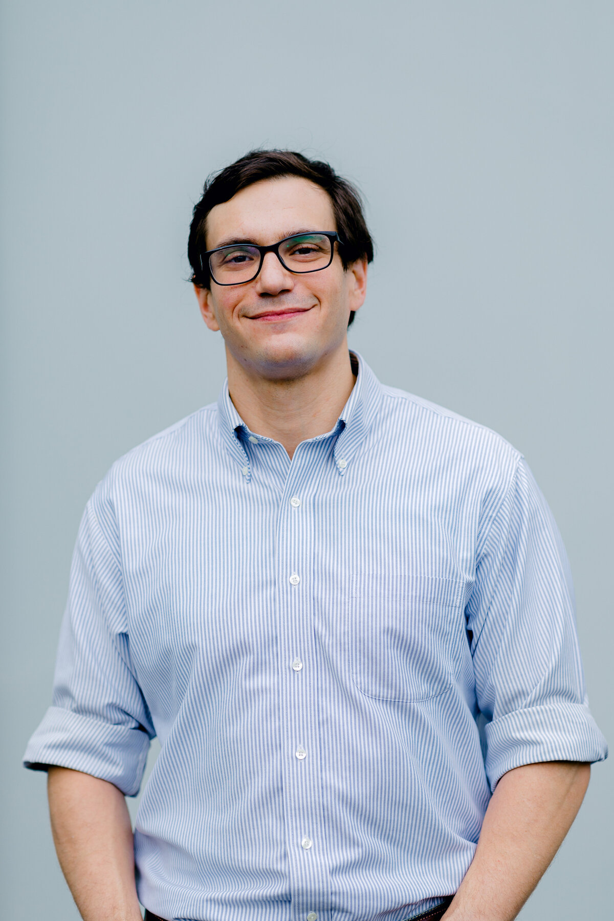 Man smiling with glasses for professional headshot