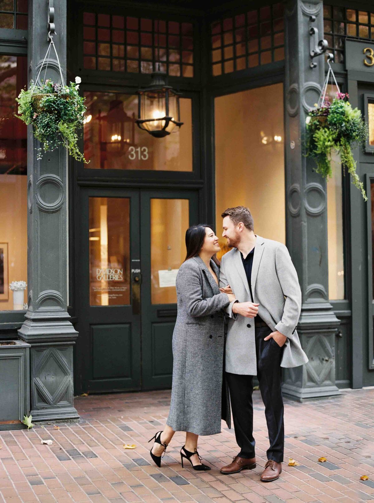 seattle engagement photographer captures film engagement photos of couple in downtown seattle pioneer square historic area