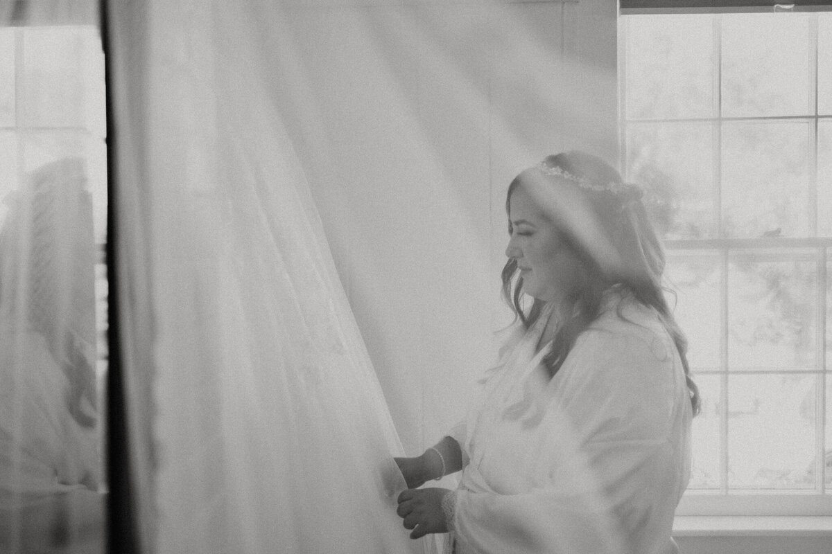 black and white image bride posing