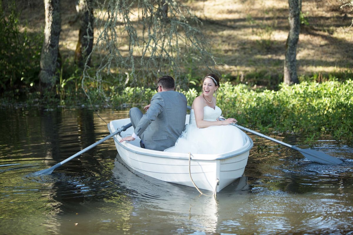 Bride and groom in row boat