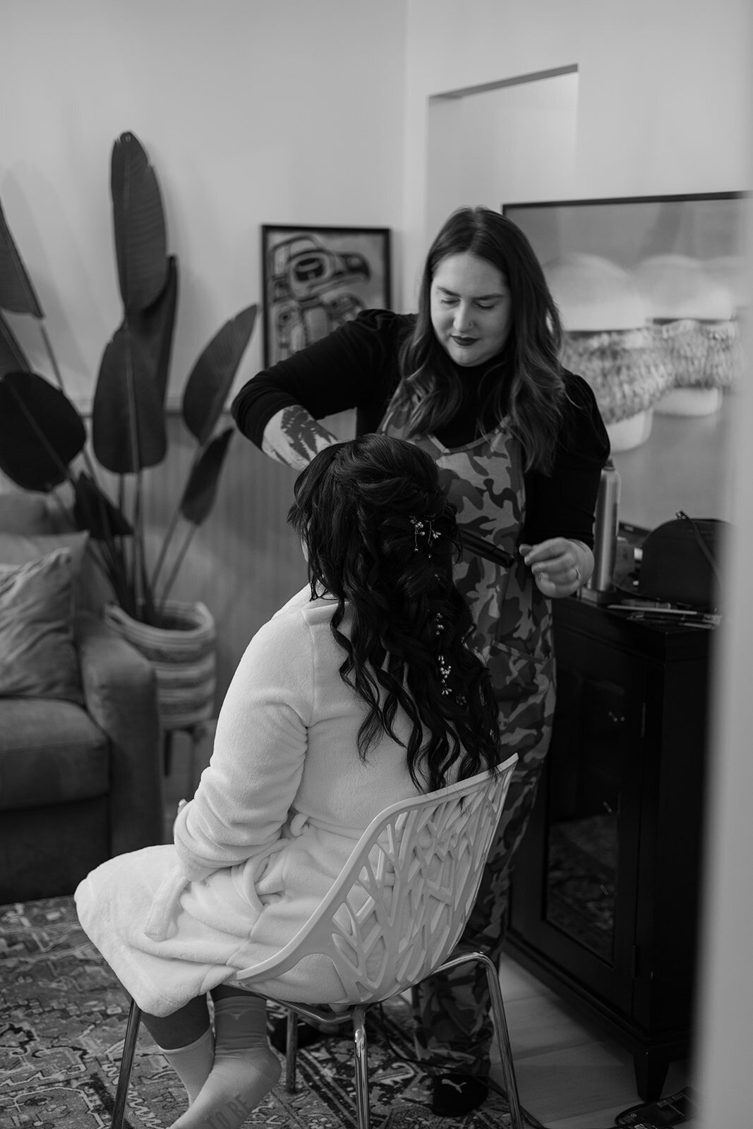 Bride’s hair styled by hairdresser in black and white.