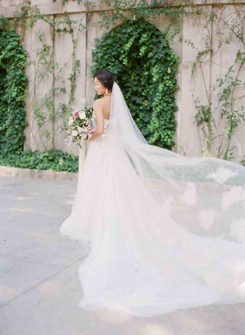 Bride with Veil Trailing Behind at Atlanta Swan House Photo