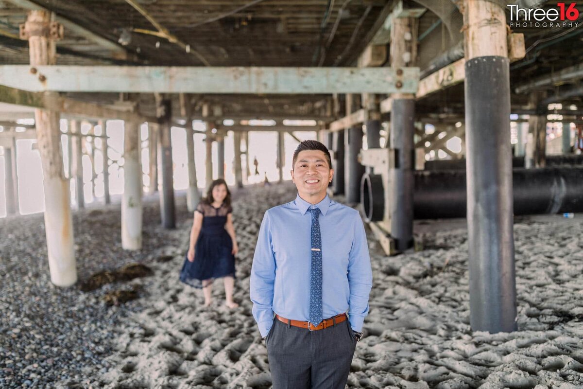 Bride to be sneaks up on her Groom under the San Clemente Pier