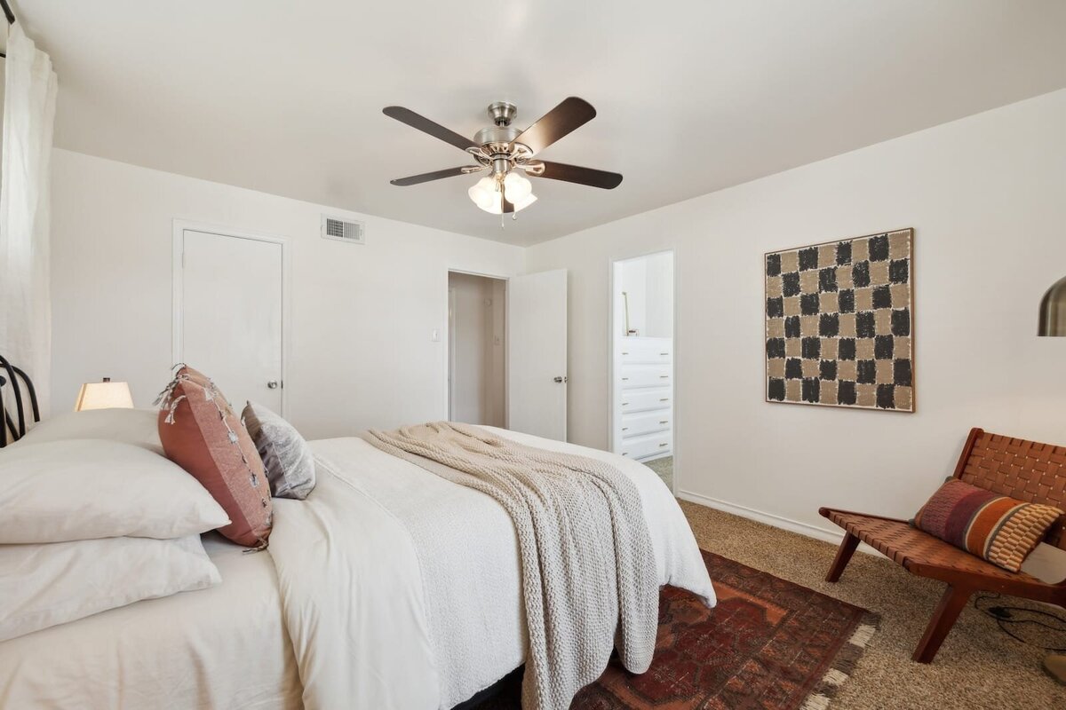 Primary bedroom suite at 3120 Chapel Downs Dr Dallas TX featuring ceiling fan, neutral tones, and access to walk-in closet — listed by Haven Realty Group.